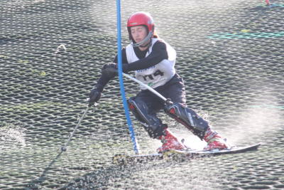 skier racing through gates 