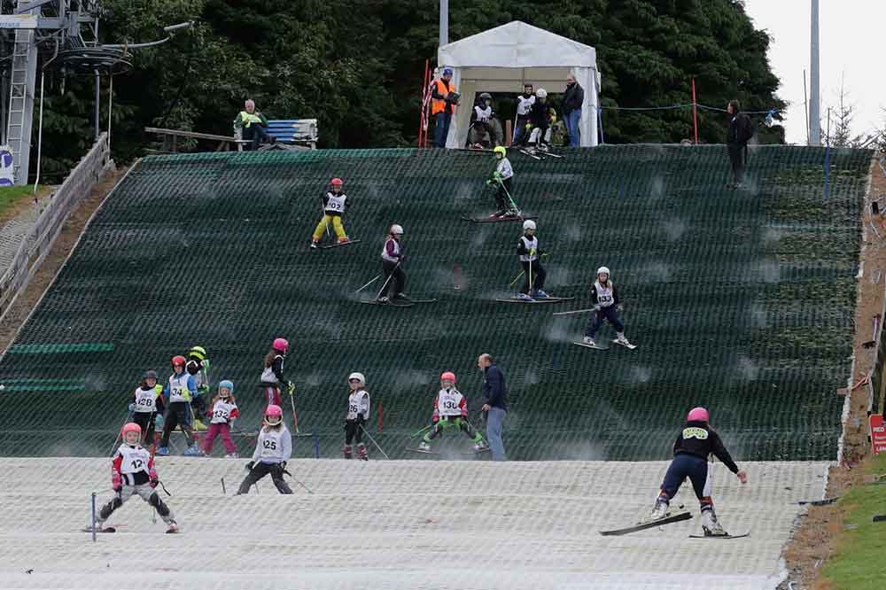 Young racer inspect the race course 